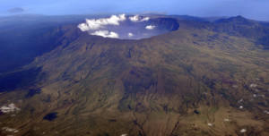 In this Oct. 19, 2010 aerial photo, Mount Tambora's 10 kilometers (more than 7 miles) wide and 1 kilometer (half a mile) deep volcanic crater, created by the April 1815 eruption, is shown. Bold farmers routinely ignore orders to evacuate the slopes of live volcanos in Indonesia, but those on Tambora took no chances when history's deadliest mountain rumbled ominously this month, Sept., 2011. (AP Photo/KOMPAS Images, Iwan Setiyawan) EDITORIAL USE ONLY