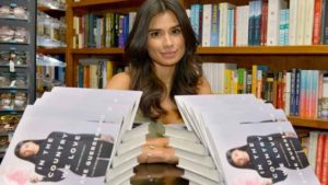 diane-guerrero-posing-with-book