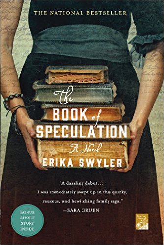 A woman wearing a blue dress holds a stack of old books. Title and author are lettered in white.