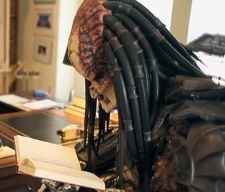 Predator reading a book