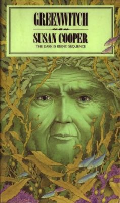 green face of a witch starring up from the sea