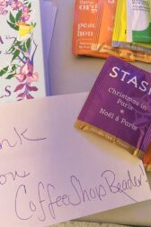 Copy of Wisteria Society ofr lady Scandals, a note that reads thank you coffee shop reader, and some packets of tea, in various flavors.
