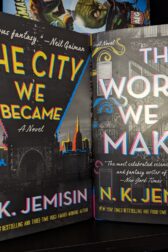 The books, "The City We Became" and "The World We Make" by N.K. Jemisin standing next to each other.