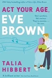 A woman with long purple dread locs embraces a man with a button up shirt