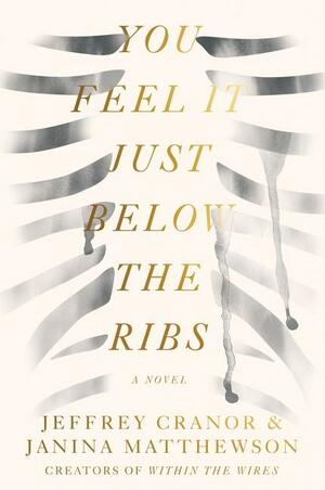 faint brush strokes evoking the image of an open human rib cage with the title You Feel It Just Below the Ribs