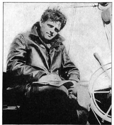 A black and white photograph of author Jack London in Alaska