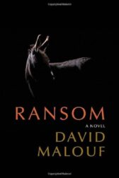A photograph of a donkey, partially in silhouette, against a black background, with the title "Ransom" in orange underneath, and the name David Malouf in tan below that.