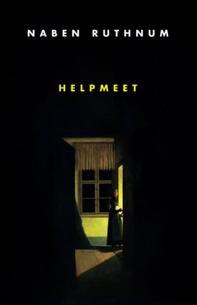 a woman stands in a darkened room illuminated by a light coming in through a doorway. she is wearing a head scarf and dress. there is a window behind her. 