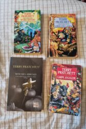 Covers of Wyrd Sisters, Witches Abroad, Lords and Ladies, and Carpe Jugulum