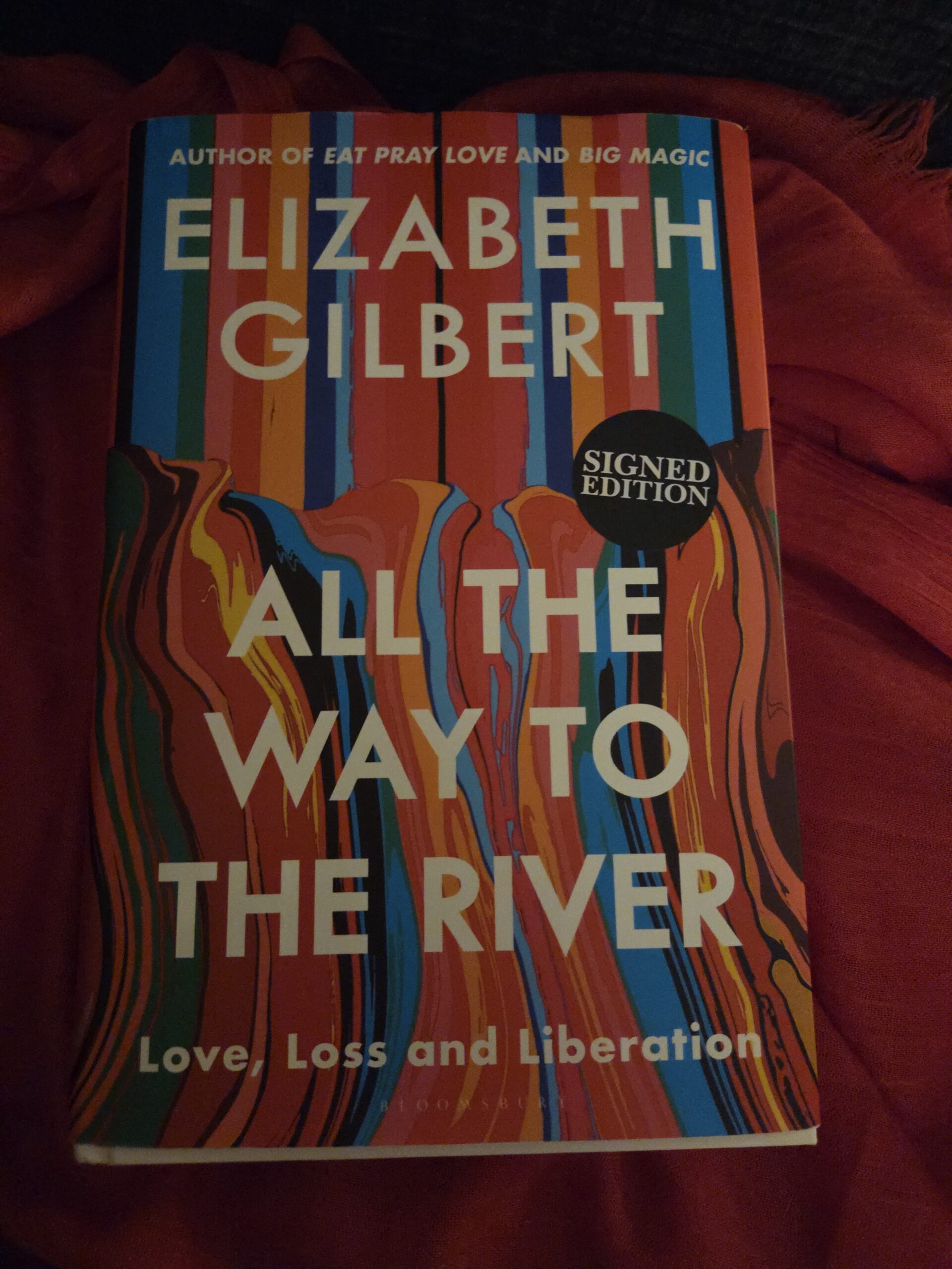 Cover of all the way to the river--red green and blue stripes dissolving