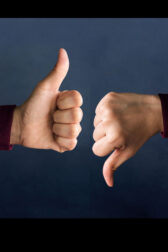 Two hands with thumbs up and down.